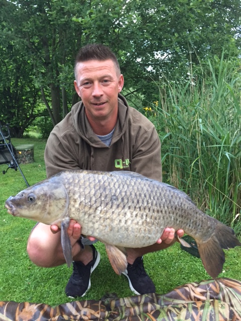 Fishing Lodge Holidays Suffolk Badwell Ash Man Holding Caught Fish