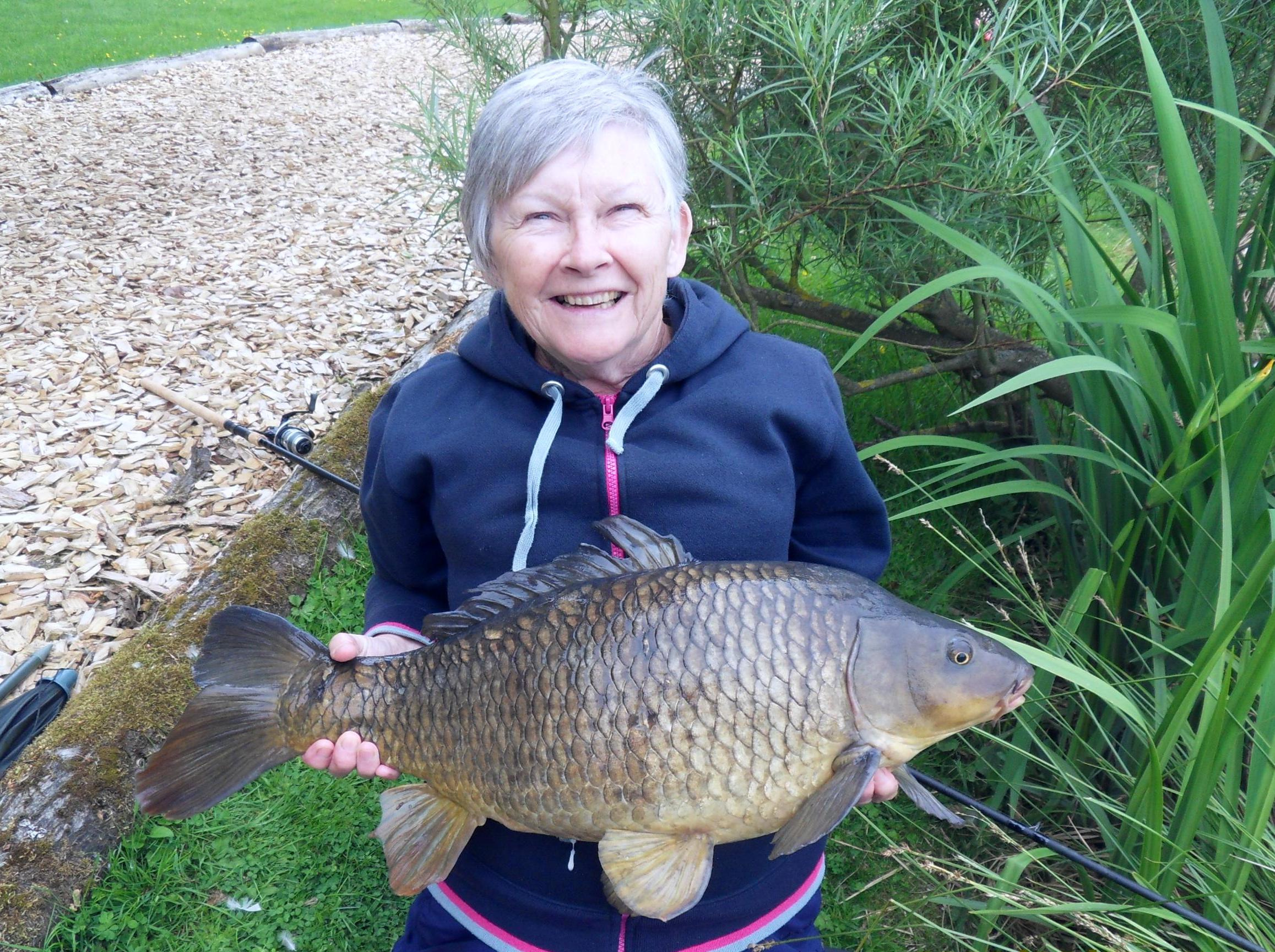 Fishing Lodge Holidays Suffolk Badwell Ash Woman Holding Caught Fish